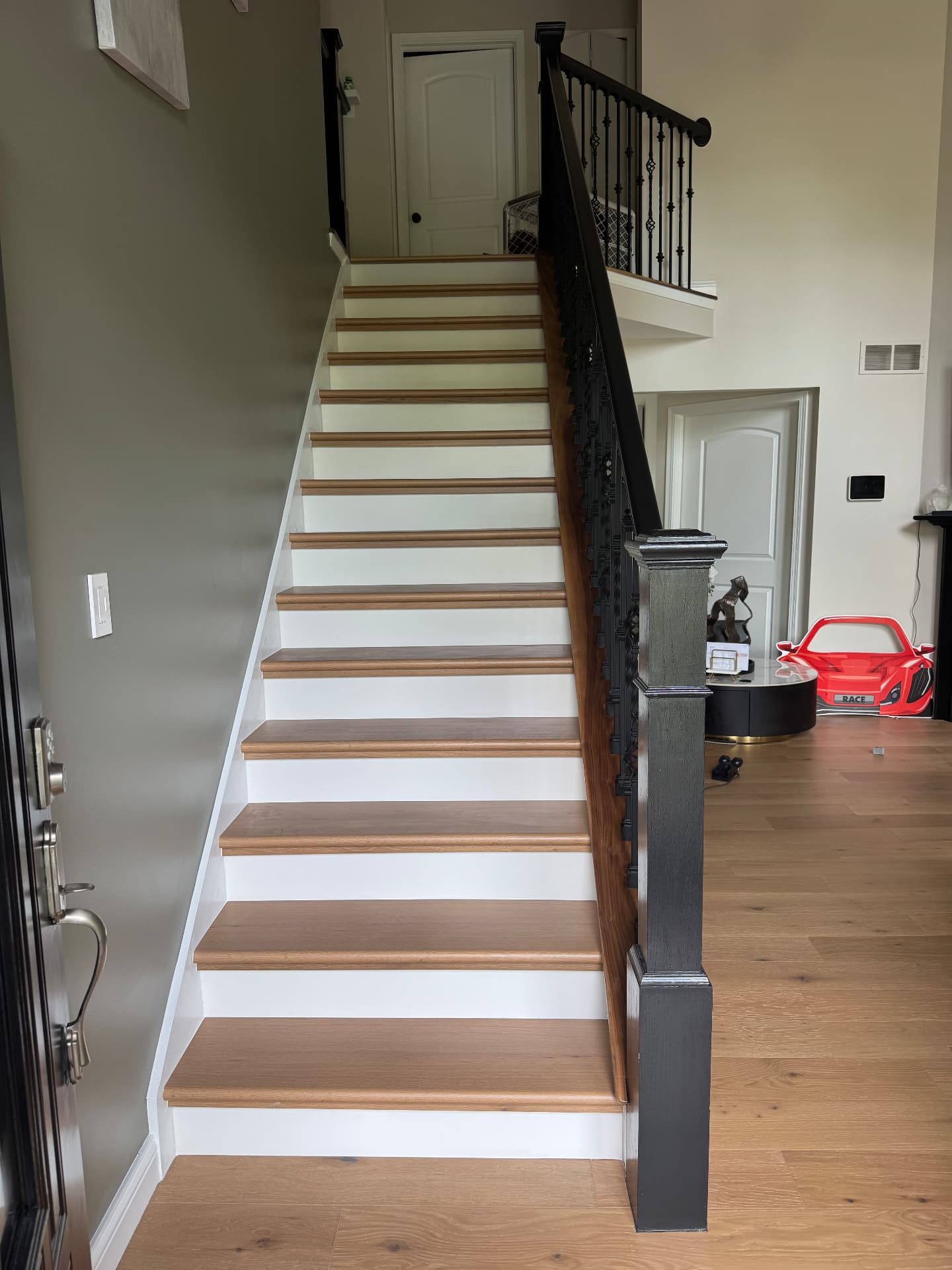 Staircase remodel — engineered waterproof wood treads with new handrails
