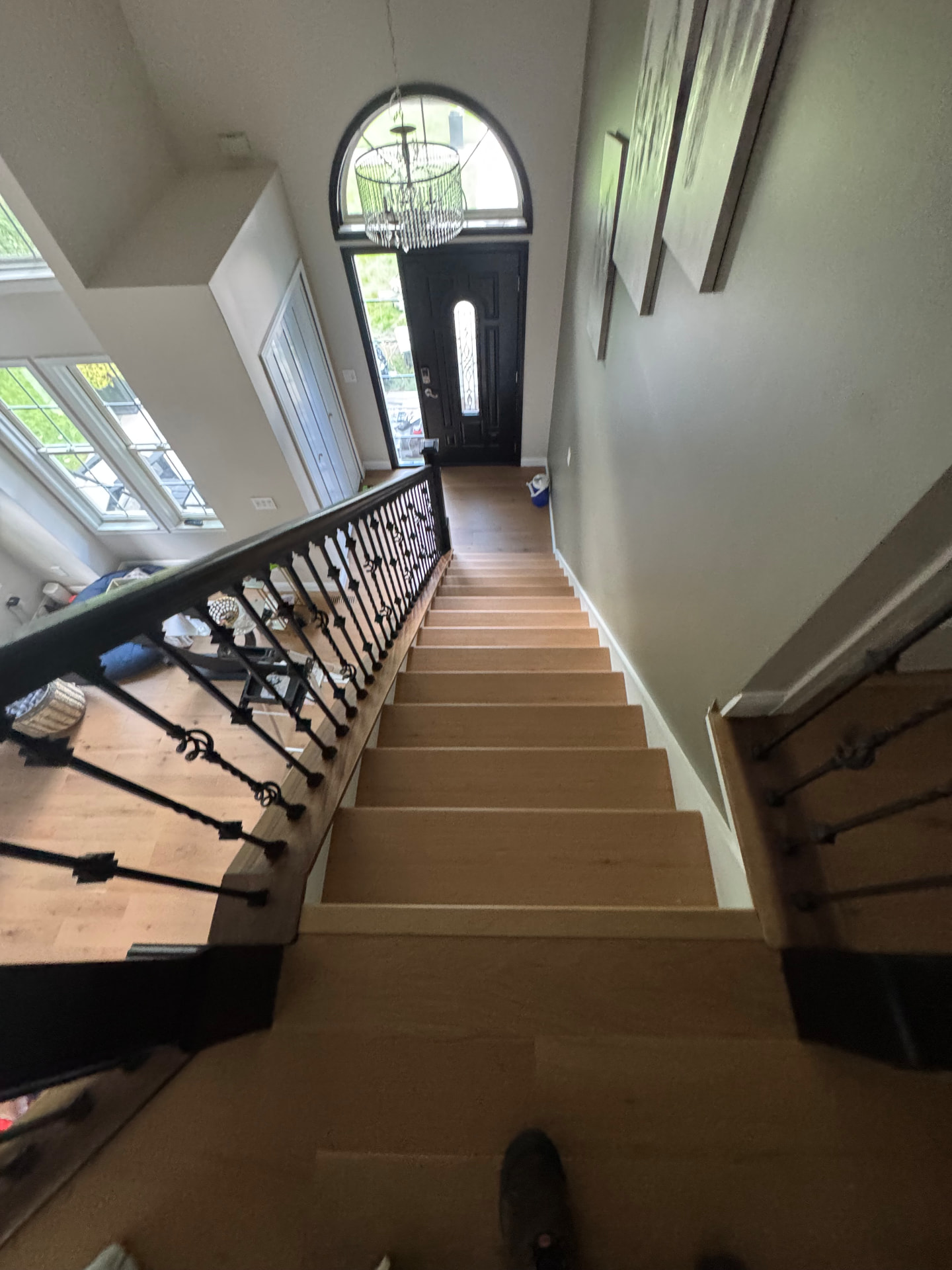 Two-story foyer staircase — waterproof engineered treads throughout